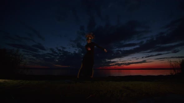 Happy Young Woman in Halloween Costume and Makeup Dances in Nature During Sunset Mystical Footage