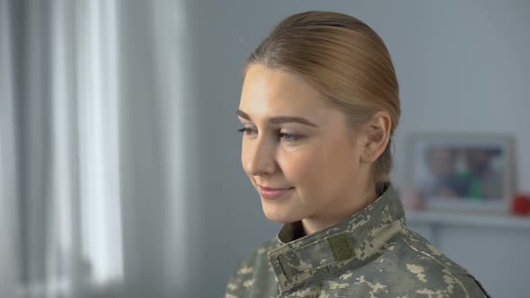 Joyful Soldier Woman in Military Uniform Looking Into Camera Independence Day
