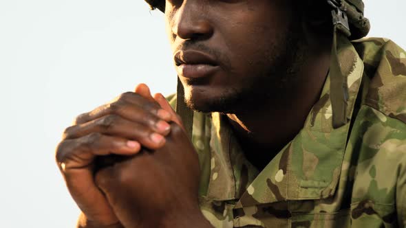 Thoughtful military soldier sitting