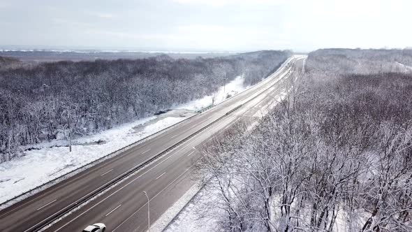 Drones Eye View  Winter Winding Road From the High Mountain Pass in Russia