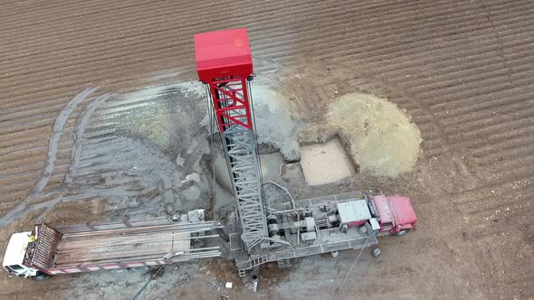 Drilling Rig Work on Flat Agricultural Brown Field