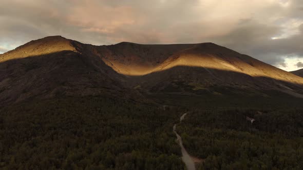 A Magnificent View of Morning Sunlight Illuminating the Khibiny Mountains Peaks