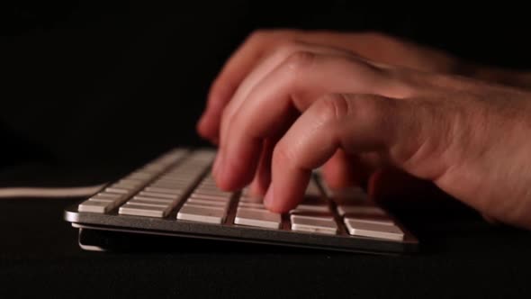 Typing on an old Apple keyboard with smooth forwarding movement.