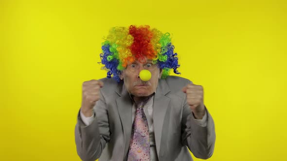 Elderly Clown Businessman Entrepreneur Boss Making Silly Faces. Copy Space