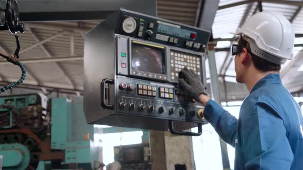 Smart Factory Worker Using Machine in Factory Workshop