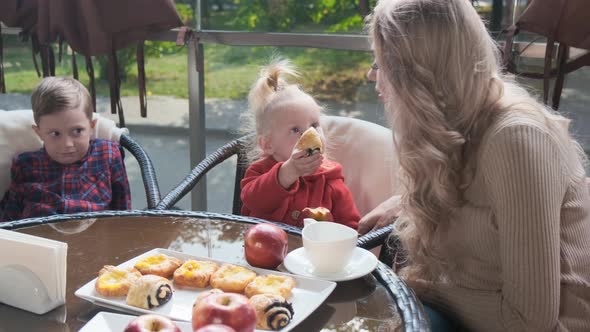 Family in a Cafe on the Terrace