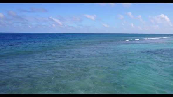 Aerial top down panorama of relaxing island beach voyage by aqua blue sea and clean sandy background