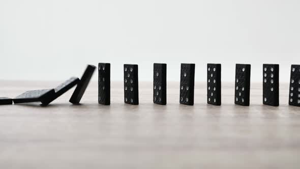 Dominoes Falling Against Each Other in Slow Motion Stock Footage