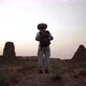 Anonymous traveler standing in desert field - VideoHive Item for Sale