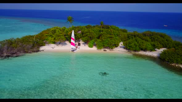 Aerial panorama of relaxing tourist beach voyage by transparent lagoon and white sandy background of