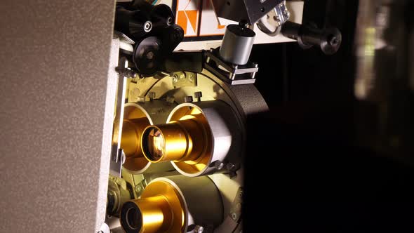 Film Runs Through a 35Mm Projector in a Movie Theater