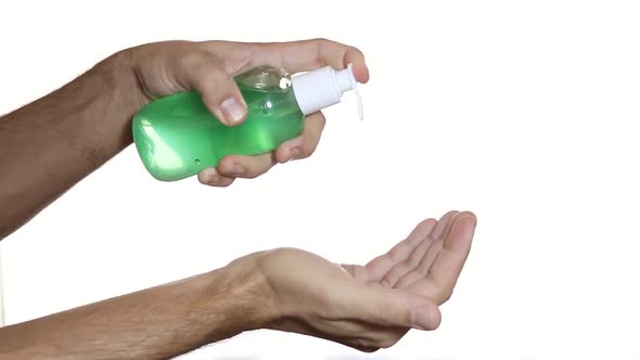 Doctor Video Footage - A Person Using A Hand Sanitizer To Clean His Hands
