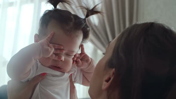 Baby Putting Feet in Her Mouth