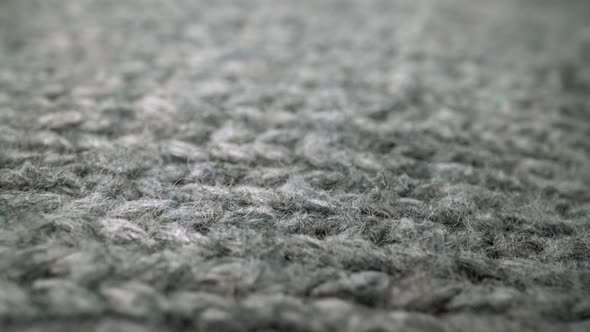 Extreme Detail View of Sheep Wool Cloth Texture Flowing in Macro Dolly Shot