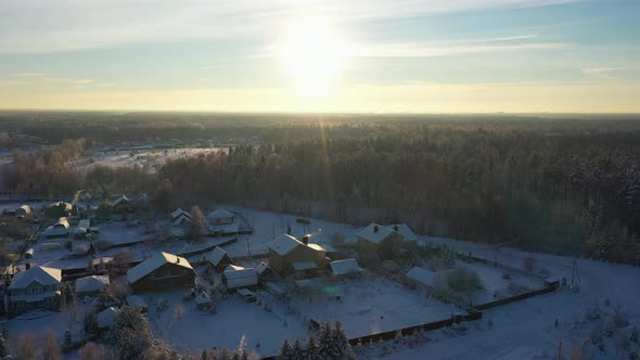 A Small Village in the Middle of a Pine Forest in Winter After Snowfall on a Bright Sunny Day