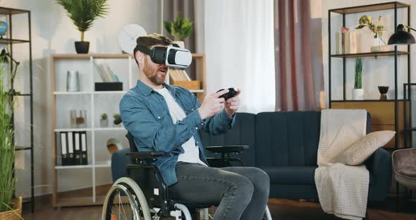 Handicapped Man in Special 3d Glasses Playing Videogame with Gamepad and is Dissatisfied