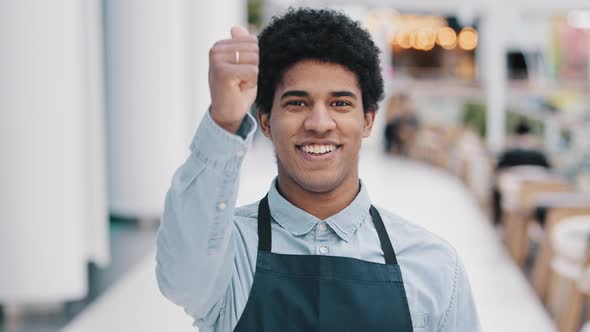 Friendly Happy African American Male Worker Waiter Salesman in Apron Man Shows Good Perfect Sign