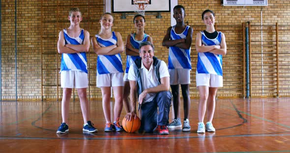 Portrait of coach and schoolkids with basketball 4k