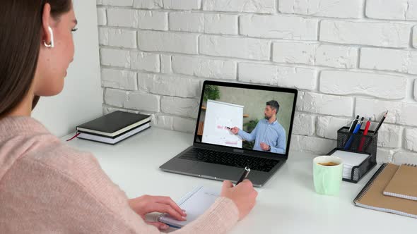 Woman Study Online Video Call Webcam Laptop Writes in Notebook Listen Teacher
