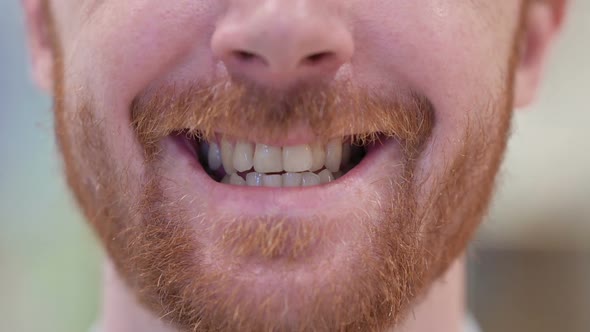 Mouth of Redhead Man Smiling at the Camera