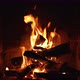 A Glowing Fire in the Stone Fireplace Warm Cozy Fireplace with Real Wood Burning in it - VideoHive Item for Sale