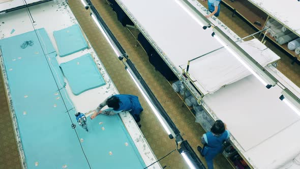 Garment Factory Unit with Female Employees Processing Fabric