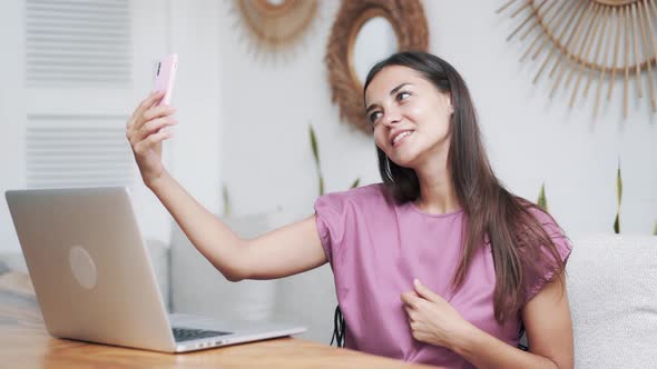 Woman Blogger Poses and Takes Story in Stylish Cafe, Takes Selfie on Phone