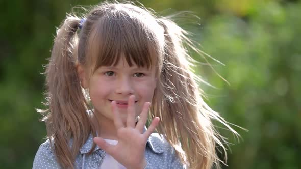 Close Up Portrait of a Pretty Smiling Little Girl