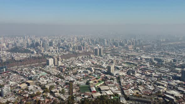 Panoramic view of Santiago de Chile from the Cerro San Cristobal Park. Pollution fog in the big city