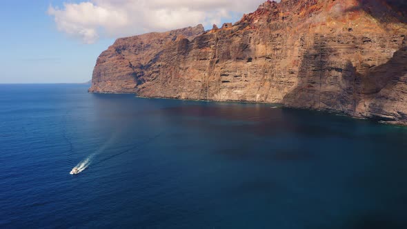 A Small Yacht Rushes Through the Expanses of Water