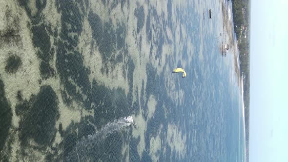 Vertical Video Kitesurfing Near the Shore of Zanzibar Tanzania Aerial View