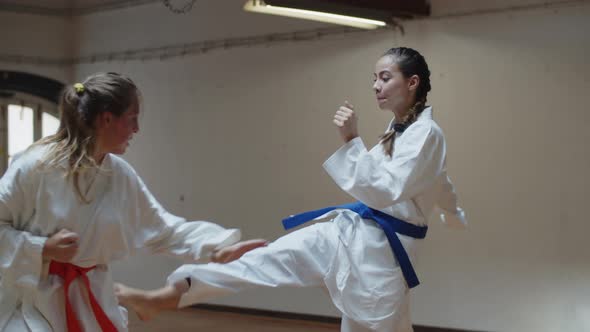 Tracking Shot of Serious Girls in Kimonos Fighting in Gym