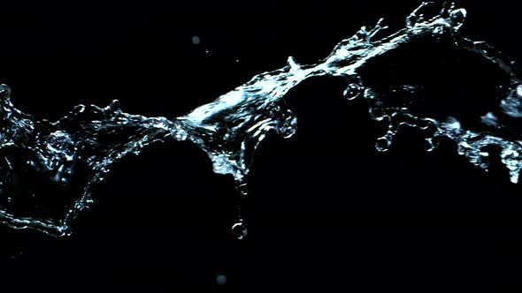 Super Slow Motion Shot of Swirling and Splashing Water Isolated on Black Background at 1000Fps