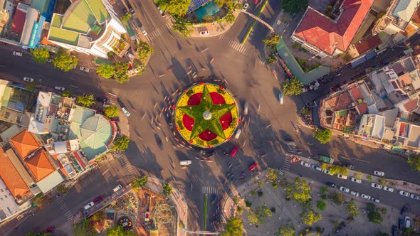 Drone hyper lapse of roundabout with traffic moving around in Nha Trang city, Vietnam