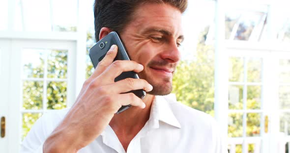 Handsome man talking on mobile phone