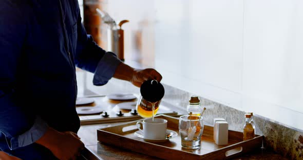 Senior man preparing coffee in the kitchen 4k