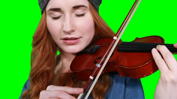 Close-up of female musician playing violin