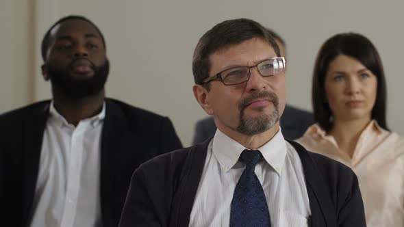 Closeup Middle Aged Man Listens To Public Speaker