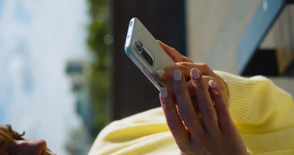 Female Hands with Smartphone Outdoor