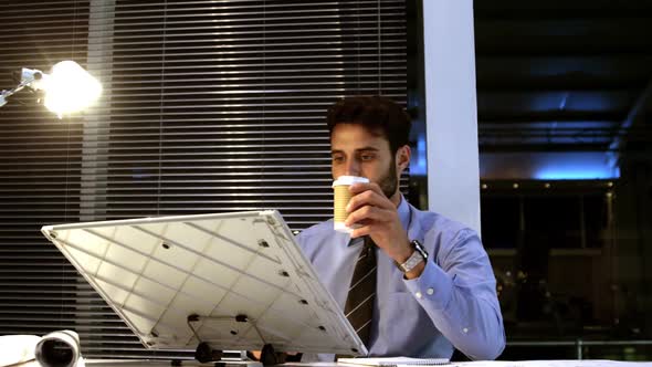 Businessman looking at whiteboard