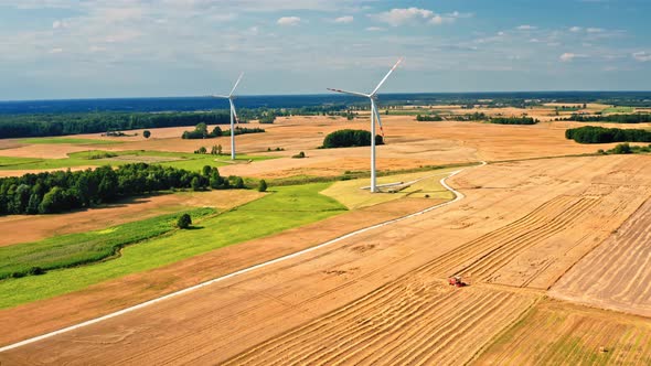 Harvest and combine on field. Aerial view of agriculture, Poland