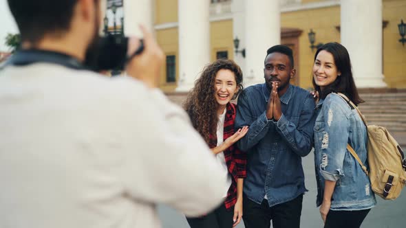 Multiethnic Group of Foreign Tourists Is Taking Photos Posing for Camera and Having Fun