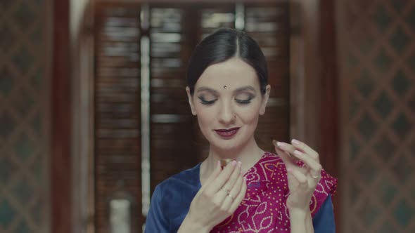 Delightful Female Enjoying Flavor of Dry Perfume