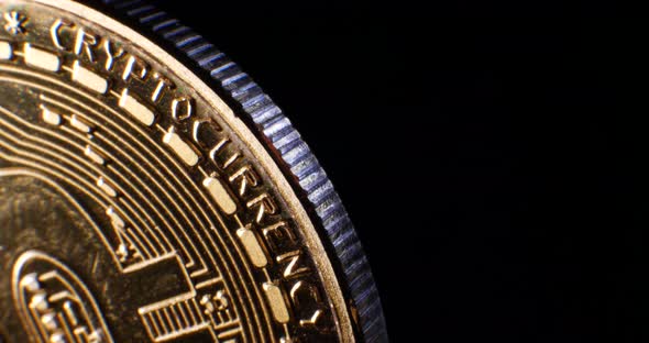 Looping macro shot of a valuable and secure digital cryptocurrency bitcoin at an encrypted financial
