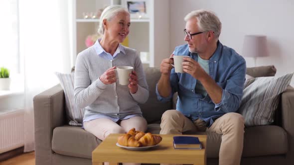 Happy Senior Couple Drinking Coffee at Home