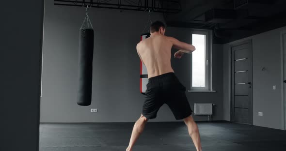 Mixed Martial Art Fighter Does Shadow Boxing and Trains at Fighter Club Fighter Man is Fighting with