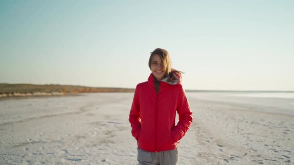 Slow Motion Young Adult Mixed Raced Woman Traveler Walking Along White Beach and Admiring Sunrise