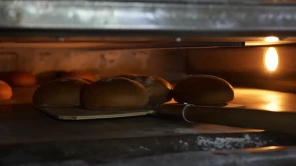 Close Up of Freshly Baked Bread Taken Out of the Oven