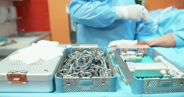 Close Up of Table with Sterilization Containers with Sterilized Tools Second Plan Slightly Blurred