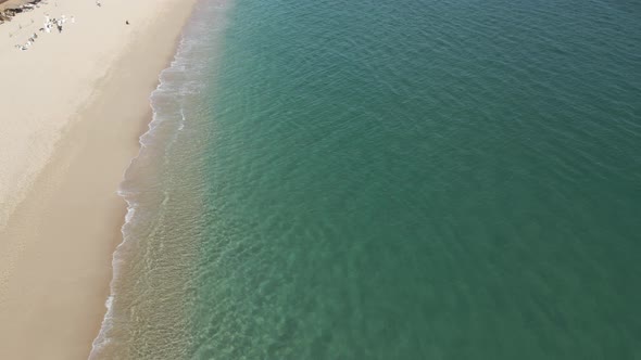 Crystal Clear Water on the Pacific Ocean Sand Shore